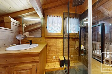 A bathroom with the word alpine on the bottom right