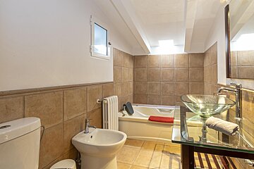 A bathroom with a sink a toilet and a bathtub