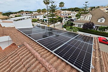 A roof with a lot of solar panels on it