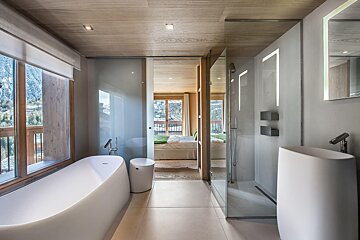 A bathroom with a bathtub and a sink
