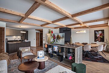 An artist 's impression of a living room and dining room