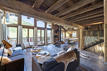 A living room with a couch and a fireplace