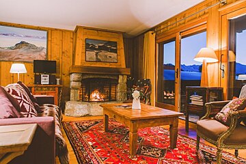 A living room with a fireplace and a couch