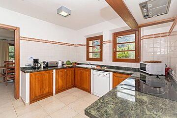 A kitchen with a microwave and a coffee maker