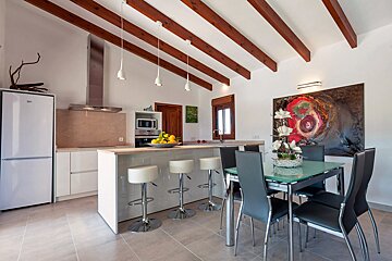 A kitchen with a refrigerator that says beko on it