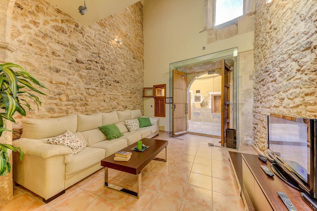 A living room with a couch and a television