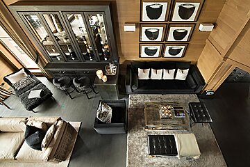 An aerial view of a living room with a couch and chairs