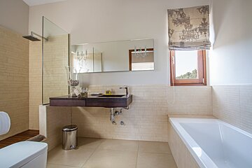 A bathroom with a sink and a bathtub