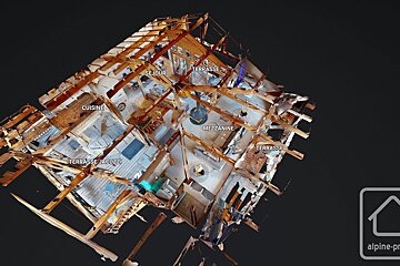 A 3D model of a wooden chalet floor plan, labeled in French, displayed on a black background.