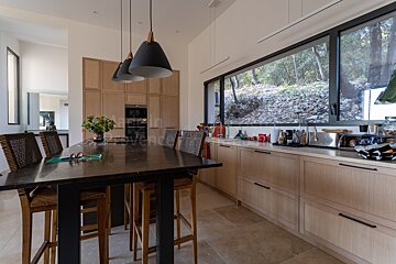 A kitchen with a table and chairs and a sign that says lavender