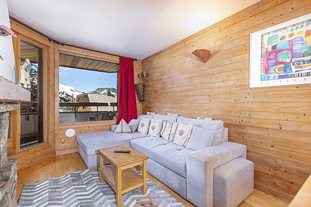 A living room with a fireplace and a couch