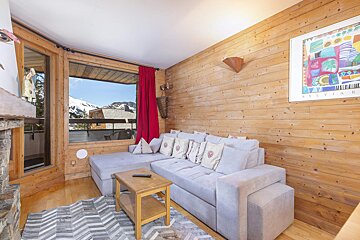 A living room with a fireplace and a couch