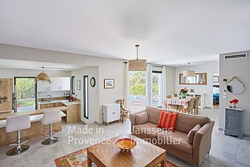 A living room with a couch and a table that says made in provence