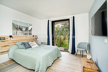 A bedroom with the words made in provence on the wall