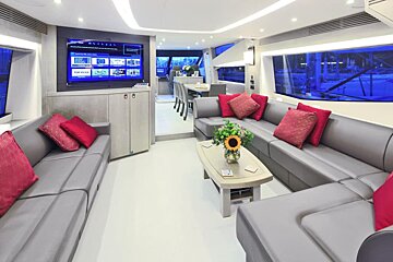 A living room on a yacht with a flat screen tv