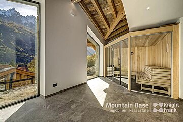 A room with a sauna and a sign that says mountain base