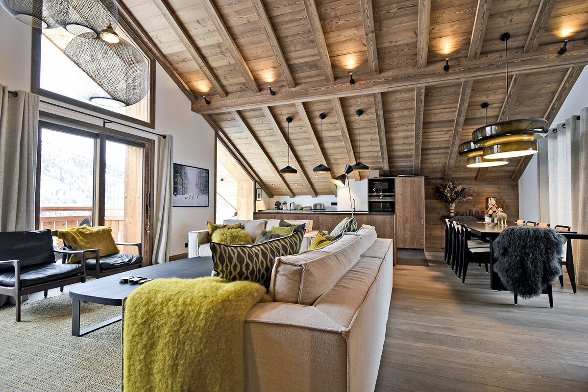A living room with a couch and a yellow blanket