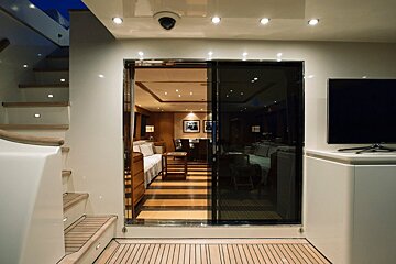 A sliding glass door leads to a living room