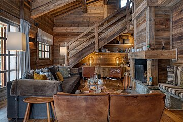 A living room filled with furniture and a fireplace