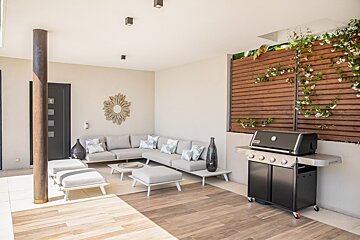 A living room with a couch and a grill