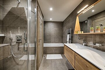 A bathroom with a bathtub and a sink