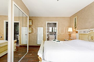 A bedroom with the word home on the wall