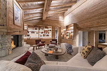 A living room filled with furniture and a fireplace