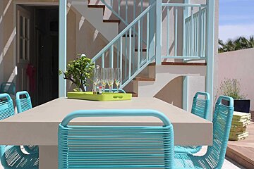 A table with a tray of champagne glasses on it