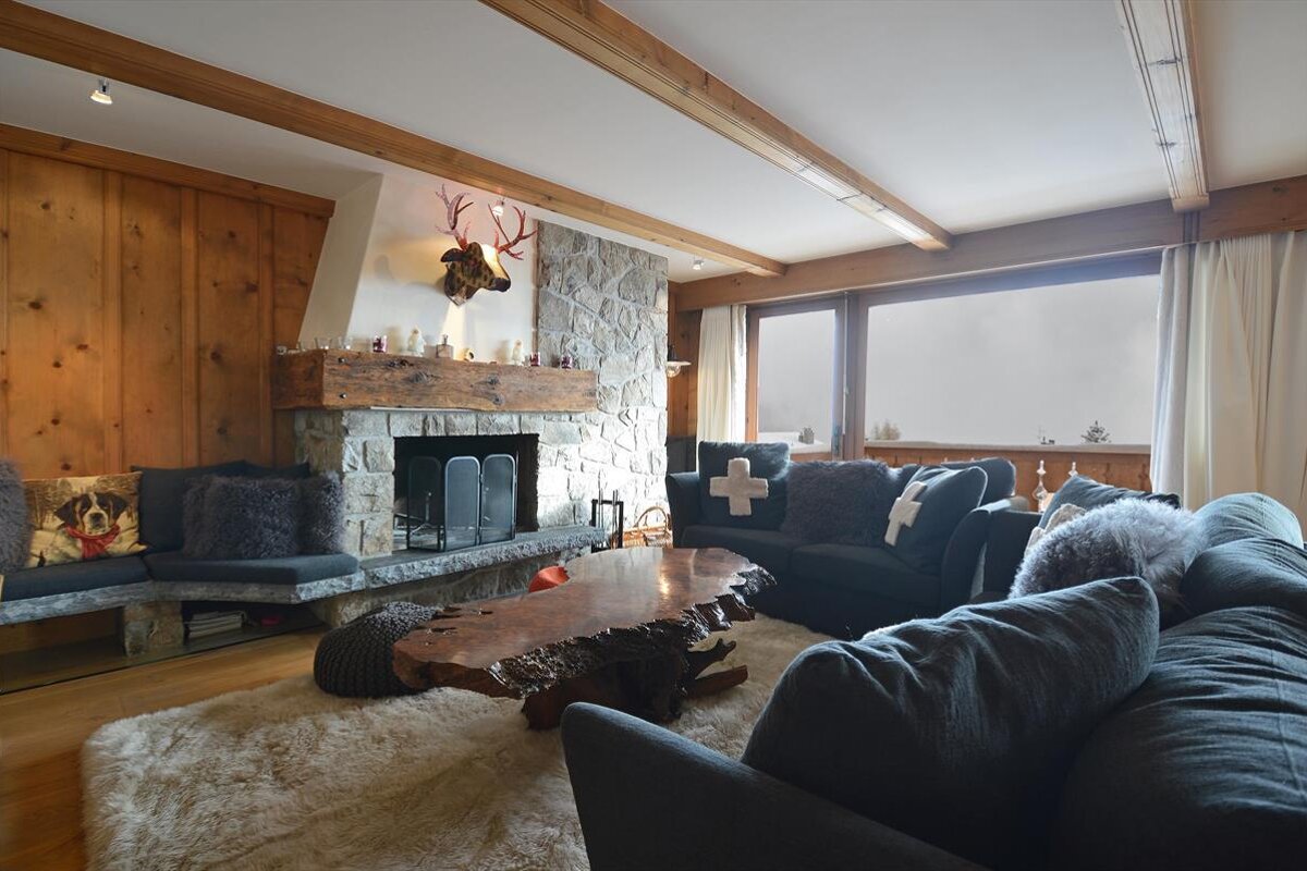 A living room with a fireplace and a couch