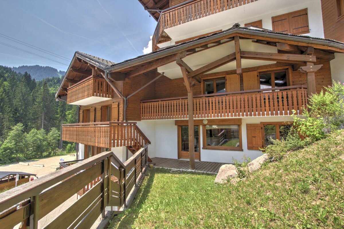 A house with a wooden balcony and stairs
