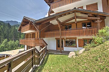 A house with a wooden balcony and stairs