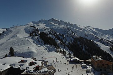 A group of people skiing down a snowy mountain