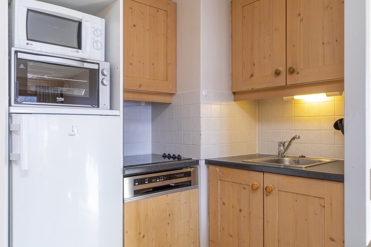 A kitchen with a lg refrigerator and a microwave