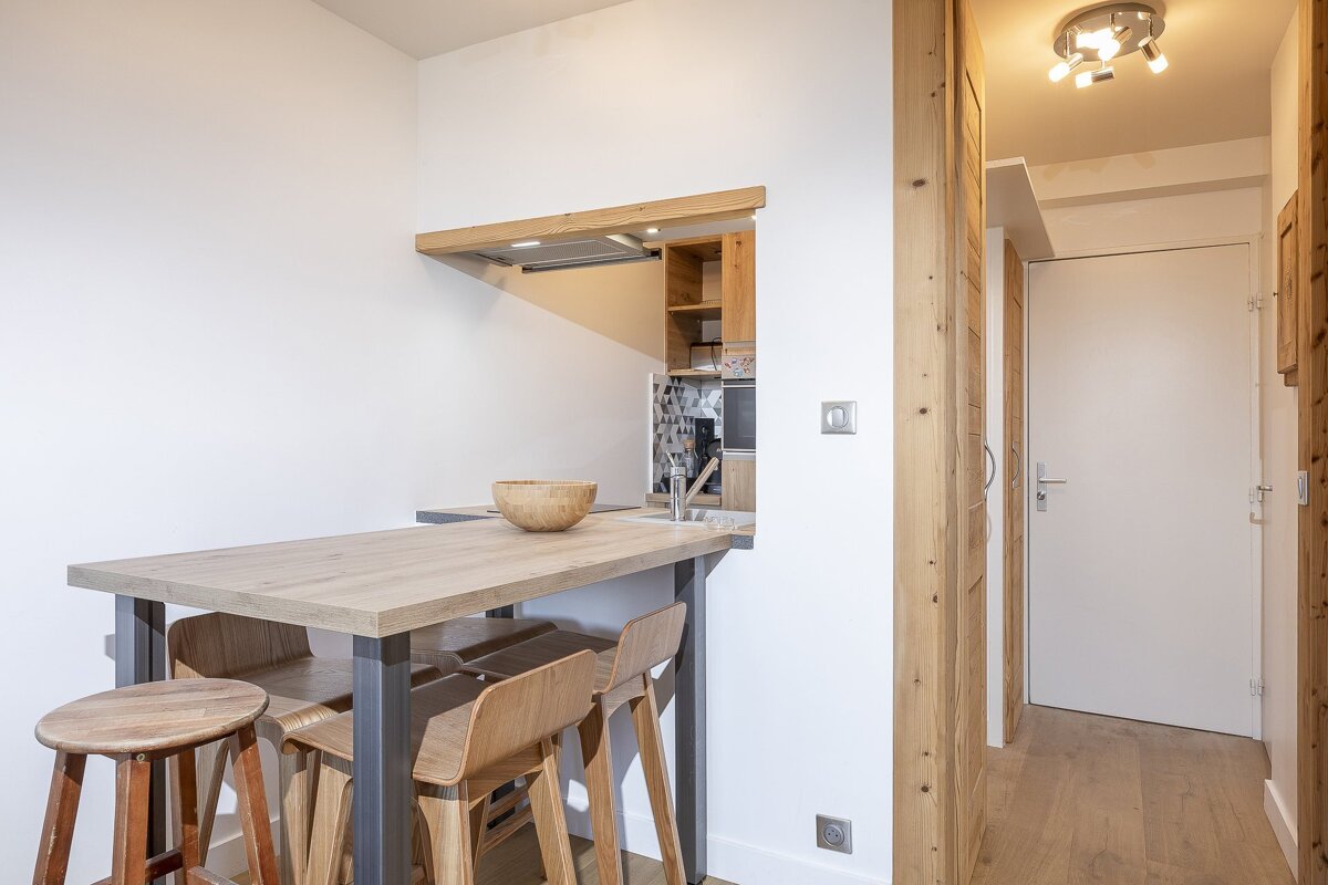 A wooden table with a bowl on top of it