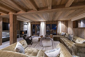 A living room filled with furniture and a fireplace