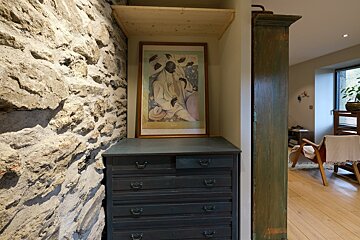 A dresser with a picture of a man on it