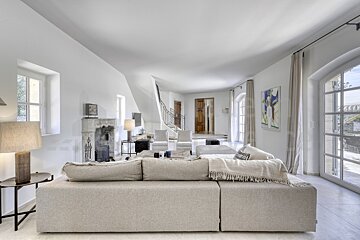 A living room with a couch and a fireplace