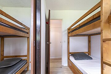 A bunk bed with a pillow on top of it