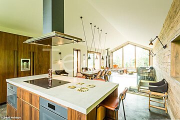 A kitchen with a stove top oven and a refrigerator that says togo holidays