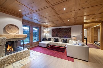 A living room with a fireplace and a couch