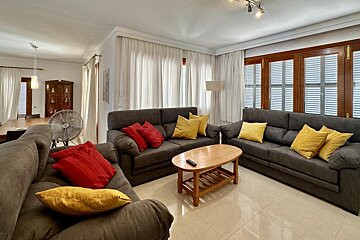 A kitchen with wooden cabinets and stainless steel appliances
