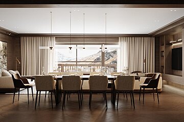 A dining room with a large table and chairs
