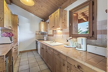 A kitchen with a coffee maker and a toaster