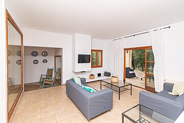 A living room with a couch and a flat screen tv