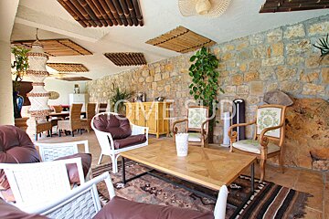 A room with a table and chairs and the word home on the wall