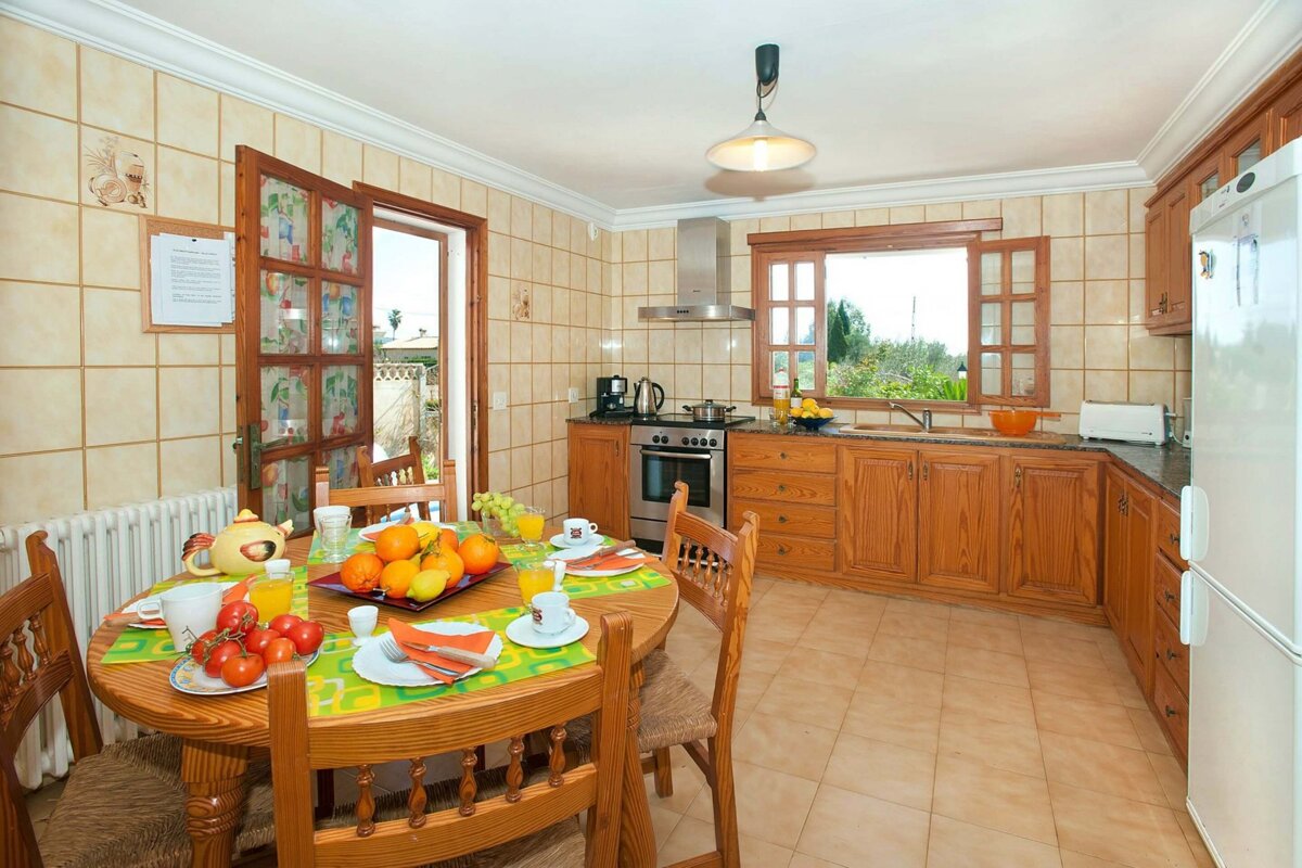 A kitchen with a sign on the wall that says