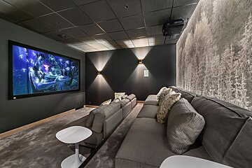 A home theater with a large screen and a projector
