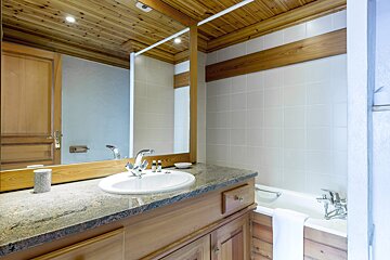A bathroom with a sink and a bathtub