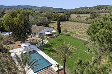 An aerial view of a house with a swimming pool