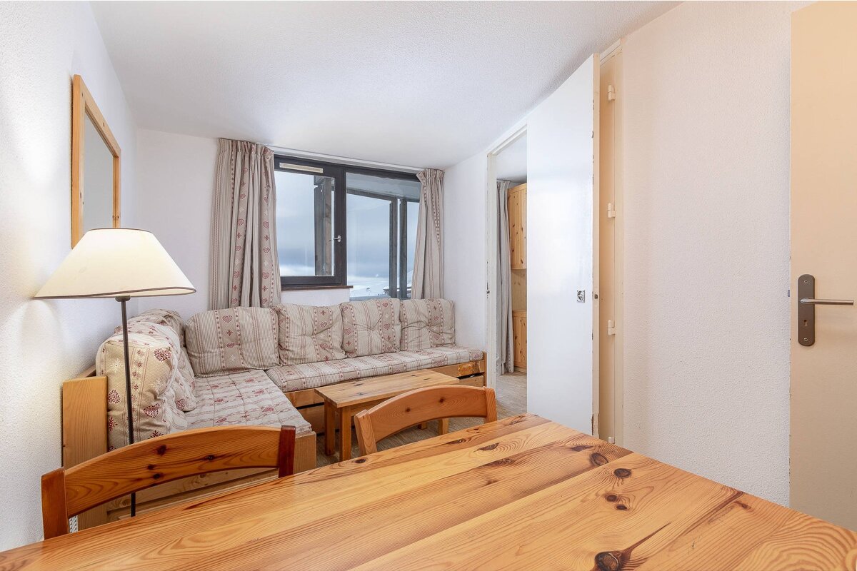 A living room with a couch and a table